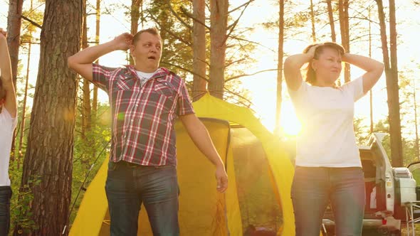 Family with One Child Stretching in Camping at Morning