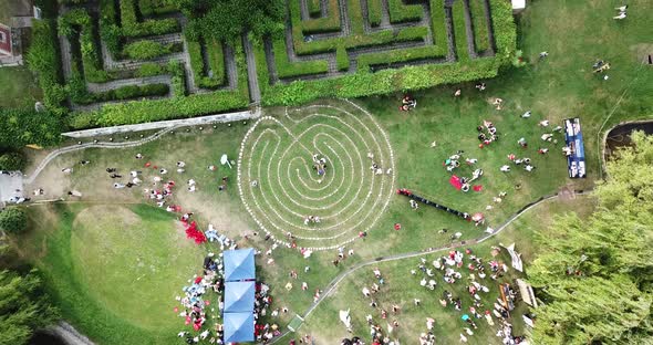 A Round Labyrinth Made of Stones on The Grass