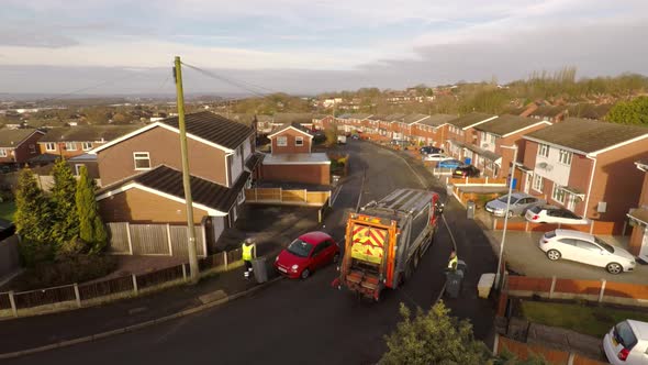 Aerial View of Dustmen putting recycling waste into a waste truck, Bin Men, Recycling day, refuse co