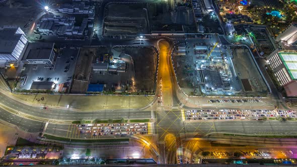 Aerial View of a Road Intersection in a Big City Night Timelapse