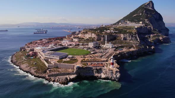 Huge waves from the Mediterranean splash from one onto the rocks of Gibraltar while in the backgroun