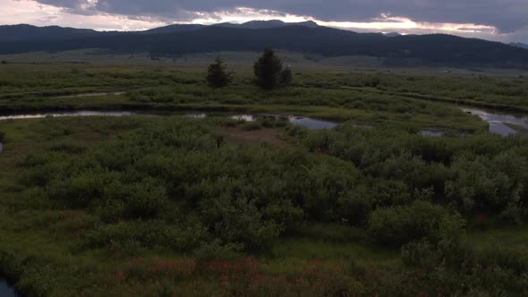 Flying at dusk over winding river