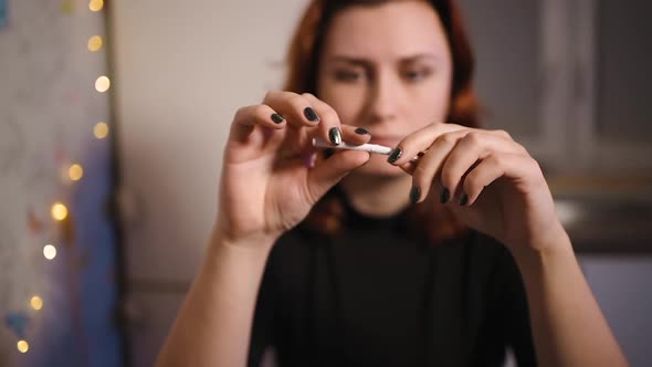 Young Woman Quits Smoking By Breaking a Cigarette