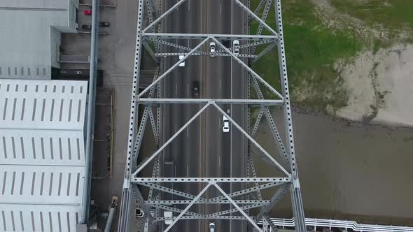 AERIAL: Overhead birds eye view of bridge and traffic.