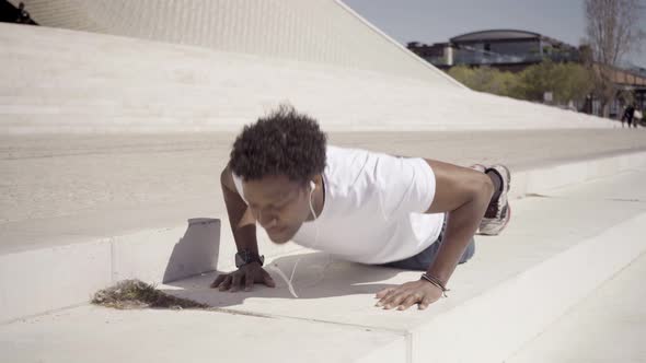 Sporty Young Man Listening Music During Workout