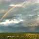 Colorful Rainbow Against Dark Stormy Clouds Forming on Gloomy Sky Before Heavy Rainfall Over - VideoHive Item for Sale