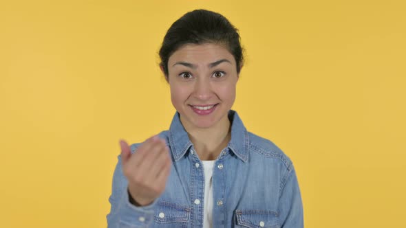 Indian Woman Pointing and Inviting, Yellow Background 