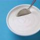 Bowl of sour cream on blue background, greek yogurt - VideoHive Item for Sale