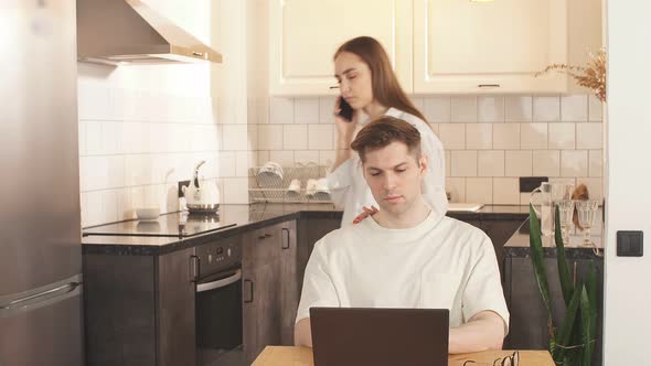 Beautiful Couple at Home, Support and Care From a Loved One During Work at Home.