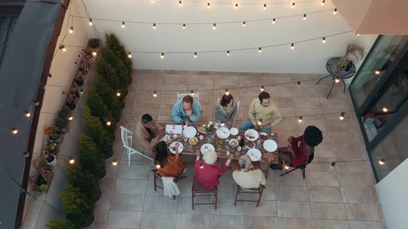 Family and friends having dinner together