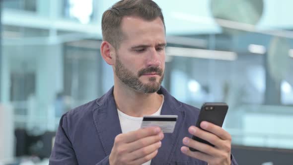 Middle Aged Businessman Having Online Payment Failure on Smartphone