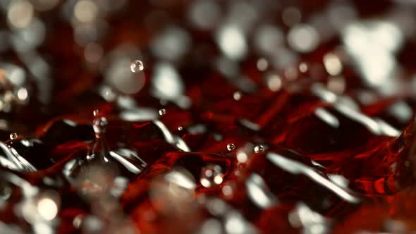 Super Slow Motion Shot of Splashing Brown Alcohol Liquid at 1000Fps alt