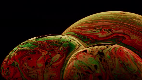 Wonderful Macro Shot of Soap Film Bubbles' Surface with Orange and Green Color