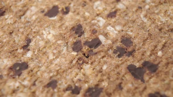 Textured surface of oatmeal cookies with chocolate pieces