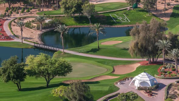 Landscape of Green Golf Course with Trees Aerial Timelapse