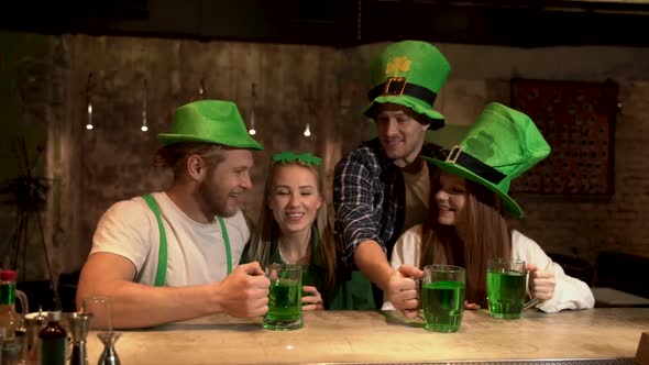 The company of young people celebrate St. Patrick's Day