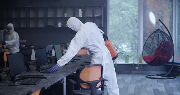 Men in Hazmat Suits Disinfecting Office