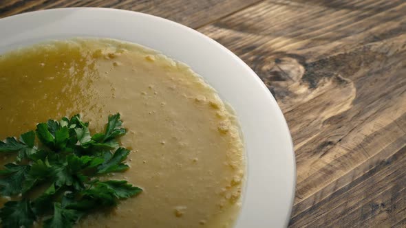 Thick Vegetable Soup On Table Moving Shot