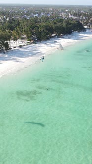 Vertical Video Kitesurfing Near the Shore of Zanzibar Tanzania