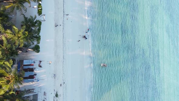 Vertical Video Boats in the Ocean Near the Coast of Zanzibar Tanzania Aerial View