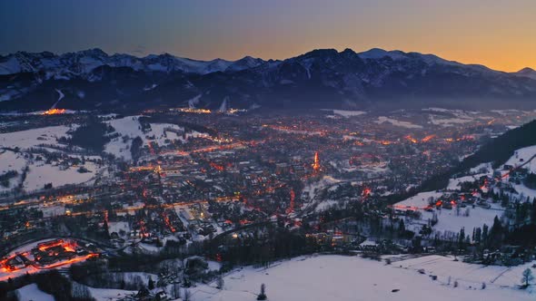 Aerial view of wonderful dusk over snowy zakopane in winter