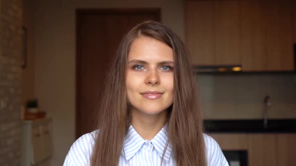 Slow motion of portrait of happy smiling business blonde, white woman