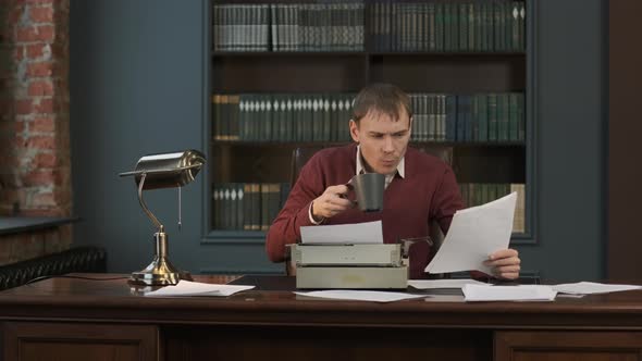 Focused Man Writing an Article or Novel Indoors