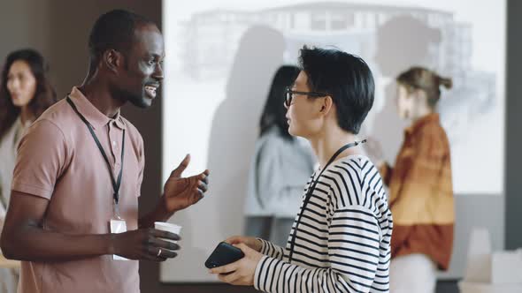 Multiethnic Colleagues Speaking on Business Event