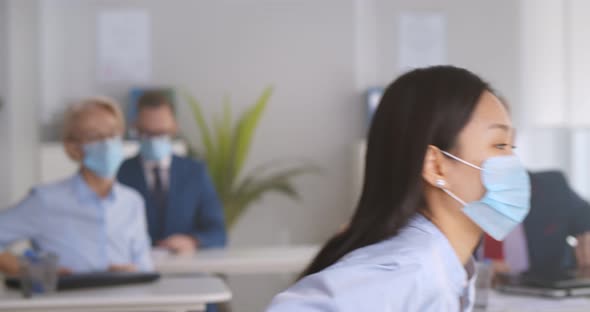 Multiethnic Businesspeople Wearing Face Masks Working in Office and Going Home in Evening