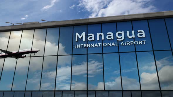 Airplane landing at Managua Nicaragua airport mirrored in terminal