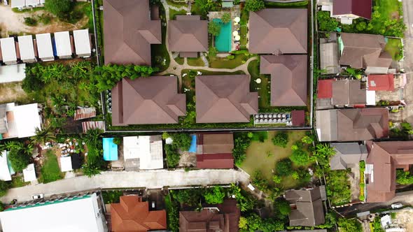 Aerial view looking down on roofs of Thailand neighborhood in Chiang Mai.