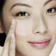 Young woman applying eye cream - VideoHive Item for Sale
