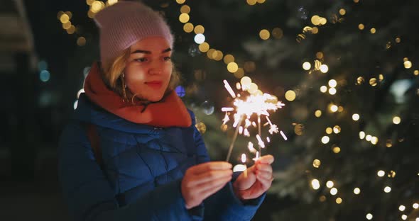 Christmas Holiday Woman Play with Sparklers