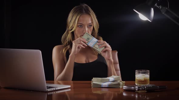 Sexy woman with a stack of money
