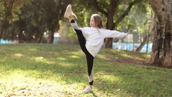 Little Girl Doing Fitness Outdoor