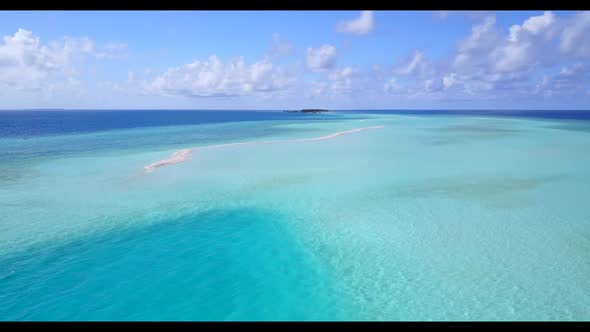 Aerial drone abstract of luxury lagoon beach vacation by blue green lagoon with white sandy backgrou