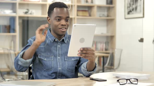 Online Video Chat on Tablet by Afro-American Man