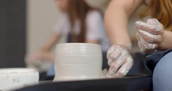 Young Woman in Pottery Studio Using Pottery Wheel Handmade Ceramics Creative