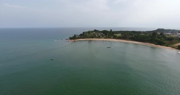 Aerial shot of the coast and horizon of Mermaids Bay in the Southwest Africa San Pedro Ivory Coast N