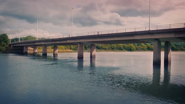 Road Bridge Over Water At Sunrise