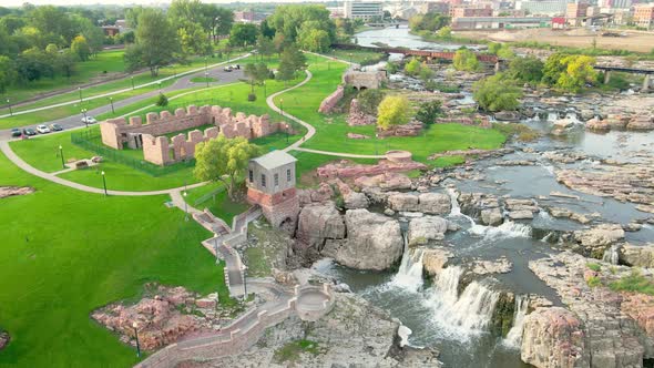 Falls Park, Sioux Falls, South Dakota, overview on a bright day. Preserved walls of old mill.
