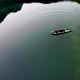The fisherman in the boat on the green lake - VideoHive Item for Sale
