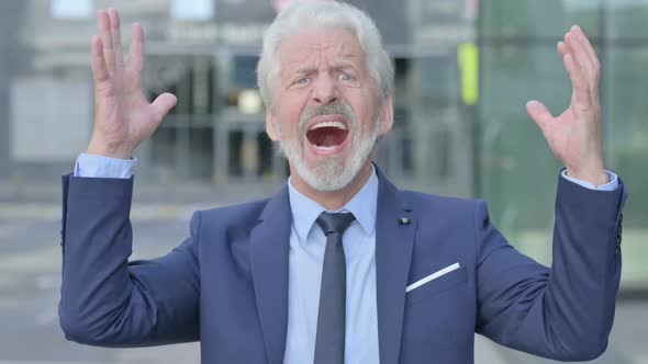 Old Businessman Screaming and Shouting Outdoor