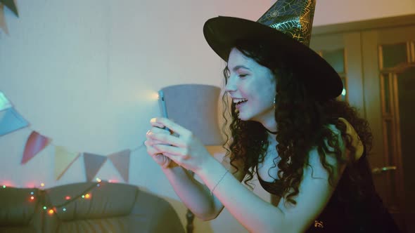A Girl Takes Pictures or Takes Pictures on Her Friends' Phone for Halloween