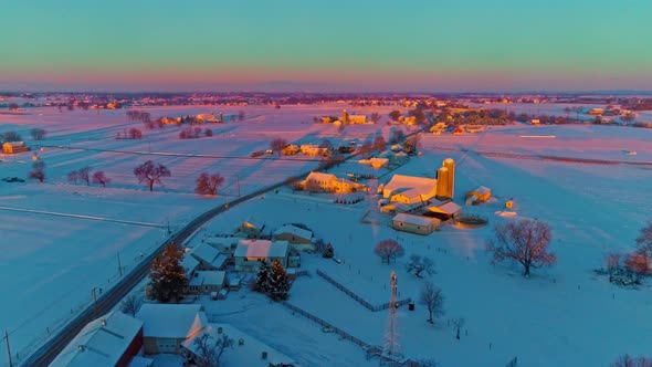 Aerial View Across Countryside Farmlands After a Early Morning Snow Fall