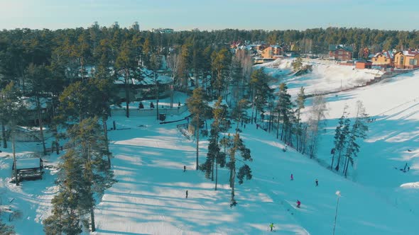 Winter Resort with Ski Tracks on Mountains Bird Eye View