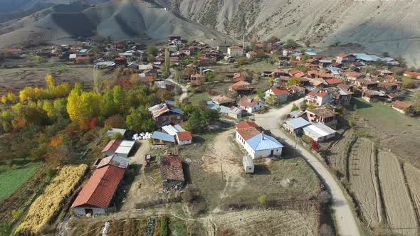 Old Village of Wooden Houses Surrounded By Arid Hills in Autumn