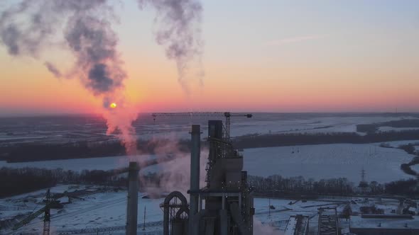 Aerial View of Cement Factory Tower with High Concrete Plant Structure at Industrial Production Area