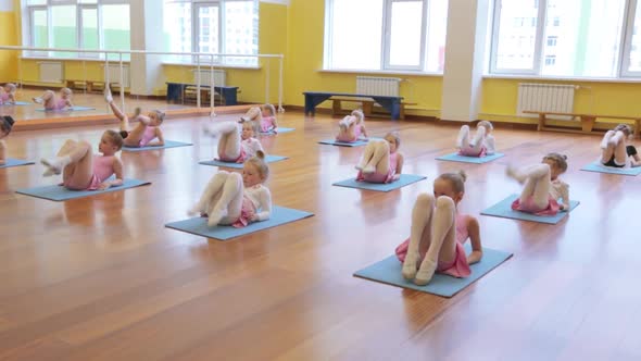 Group of little girls practicing in ballet school