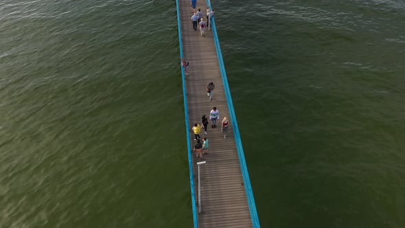 Tourists on the pier in Zelenogradsk, Russia